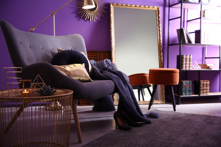 Large mirror and comfortable armchair in the living room. interior designの写真素材