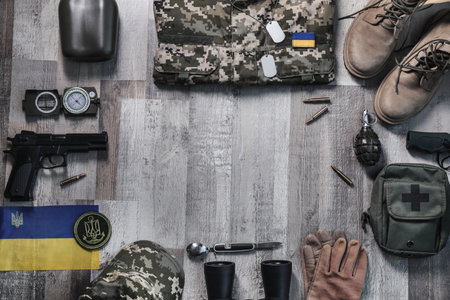 MYKOLAIV, UKRAINE - SEPTEMBER 19, 2020: Ukraine military outfit and equipment on floor, flat lay. Space for textの写真素材