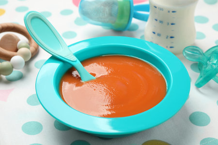 Healthy baby food in bowl on table, closeupの写真素材
