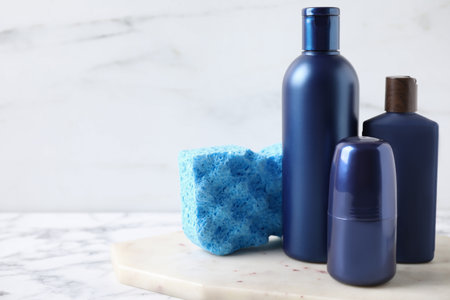 Set of different men's cosmetic products on white marble table. Space for textの写真素材