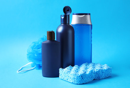 Set of different men's cosmetic products on light blue backgroundの写真素材