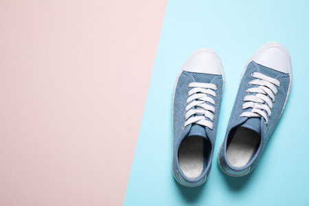 Gumshoes on color background, top view. Space for textの写真素材