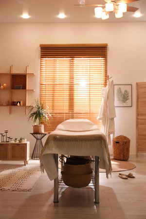 Stylish massage room interior in spa salonの写真素材