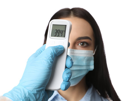 Doctor measuring woman's temperature on white background, closeup.の写真素材