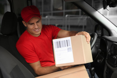 Courier in car with packages. delivery serviceの写真素材