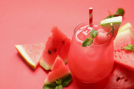 Tasty watermelon drink and fresh fruits on red background, space for textの写真素材