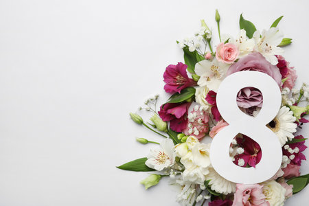 8 March greeting card design with beautiful flowers on white background, flat lay and space for text. International Women's dayの写真素材