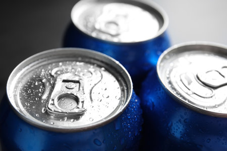 Cans of with water drops, closeup