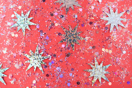 Shiny glitter on red background, flat layの写真素材