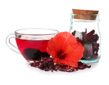 Delicious hibiscus tea and dry flowers on white backgroundの写真素材