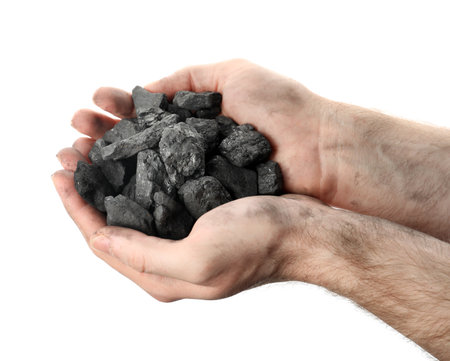 Man holding coal in hands on white background, closeupの写真素材