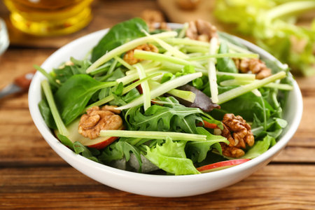 Delicious fresh celery salad on wooden table, closeupの写真素材