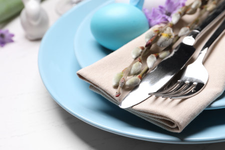 Festive Easter table setting with egg on white background, closeupの写真素材