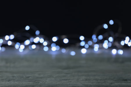 Beautiful lights on gray table, blurred viewの写真素材