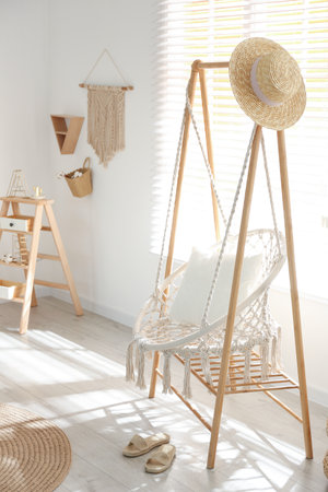 Comfortable hammock chair in stylish room. home interiorの写真素材