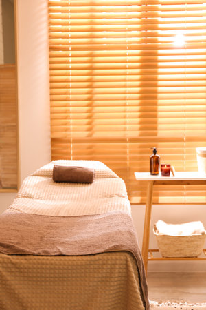 Stylish massage room interior in spa salonの写真素材