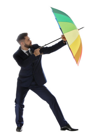 Businessman with rainbow umbrella on white backgroundの写真素材