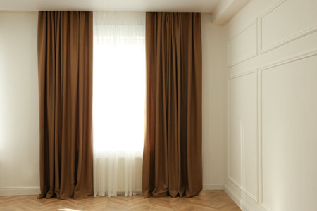 Window with elegant curtains in modern roomの写真素材