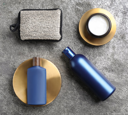 Flat lay composition with men's cosmetics on gray stone backgroundの写真素材