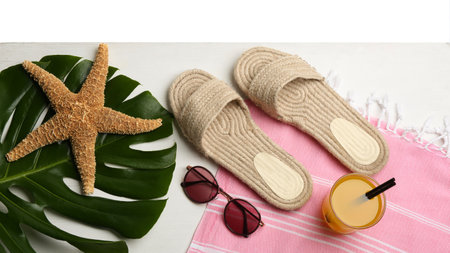 Beach accessories and drink on white wooden table, flat layの写真素材