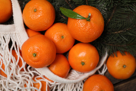 Fresh ripe tangerines on wooden table, above viewの写真素材