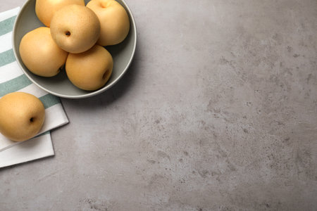 Fresh apple pears on grey table, flat lay. Space for textの写真素材