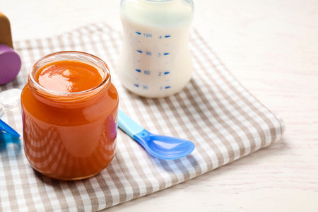 Healthy baby food in jar on table. Space for textの写真素材
