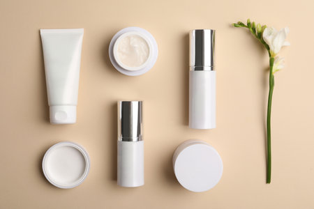 Set of luxury cosmetic products on beige background, flat layの写真素材