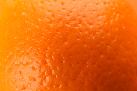 Delicious unpeeled orange fruit as background, closeupの写真素材