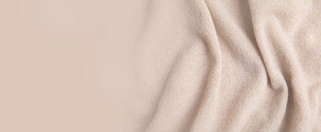 Warm cashmere fabric as background, top view with space for text. banner designの写真素材