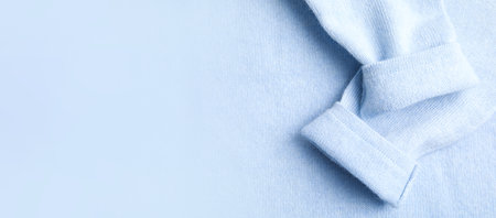 Warm cashmere sweater as background, top view with space for text. banner designの写真素材