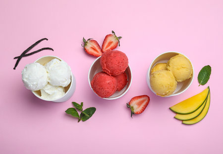 Different delicious ice creams on pink background, flat layの写真素材