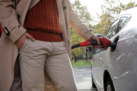 Man refueling car at self service gas station, closeupの写真素材