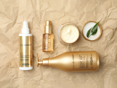 MYKOLAIV, UKRAINE - AUGUST 08, 2020: Flat lay composition with L'Oreal hair care cosmetic products on crumpled paperのeditorial素材