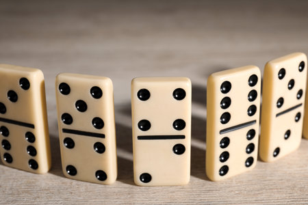 Classic domino tiles on wooden table, closeupの写真素材