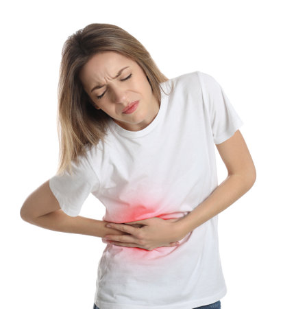 Young woman suffering from liver pain on white backgroundの写真素材