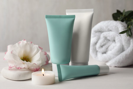 Composition with cosmetic products on white tableの写真素材