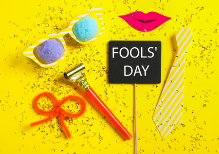 Different clown's accessories on yellow background, flat layの写真素材