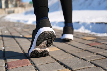 Man running outdoors on winter day, closeup. sports exercisesの写真素材