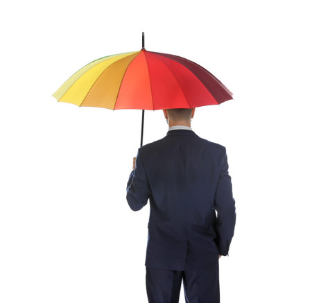 Businessman with rainbow umbrella on white background, back viewの写真素材