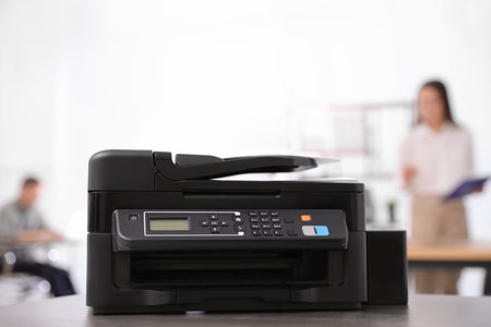 New modern printer on table in officeの素材 [FY310200937772]