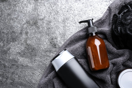 Flat lay composition with men's cosmetics on gray stone background. Space for textの写真素材