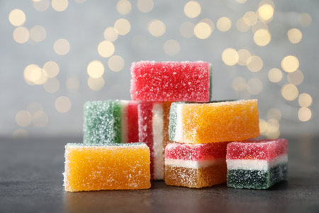 Pile of fruit jelly candies on gray table, closeupの写真素材