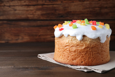 Traditional decorated Easter cake on wooden table. Space for textの写真素材