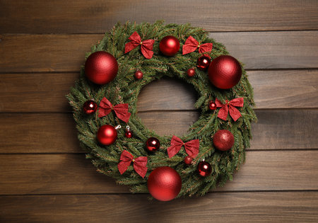 Beautiful Christmas wreath on wooden background, top viewの写真素材