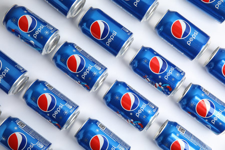 MYKOLAIV, UKRAINE - FEBRUARY 08, 2021: Cans of Pepsi on white background, flat lay