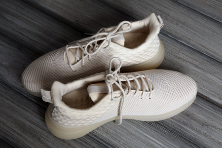 Pair of stylish shoes with laces on wooden backgroundの写真素材