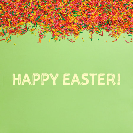 Text Happy Easter and colorful sprinkles on green background, flat lay. Confectionery decor