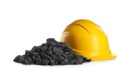 Heap of coal and hard hat isolated on whiteの写真素材
