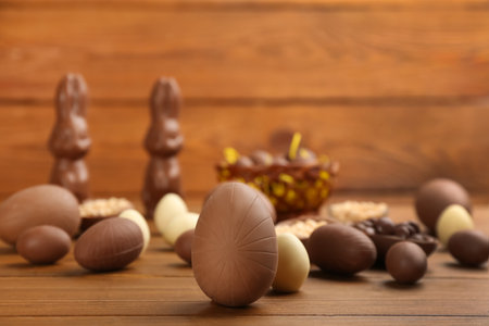 Sweet chocolate eggs on wooden table. Space for textの写真素材